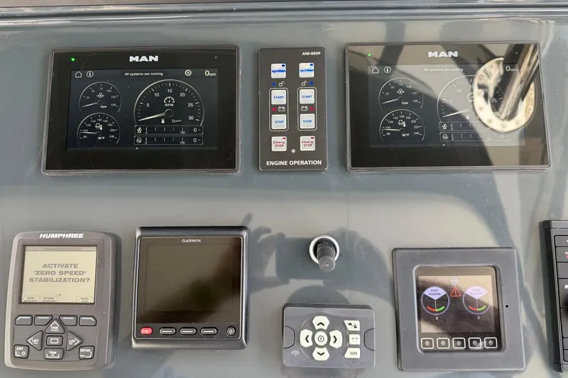 Slide: The Image of Control panel of 2024 Sirena 88 yacht with navigation and engine displays. - 38