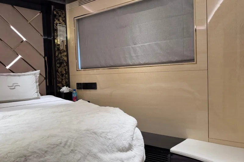 Slide: The Image of Luxurious interior of 2024 Sirena 88 yacht with elegant bedding and modern design. - 87