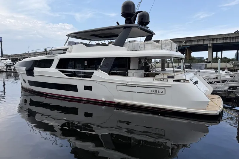 Slide: The Image of 2024 Sirena 88 yacht docked at marina, showcasing sleek design and modern features. - 6