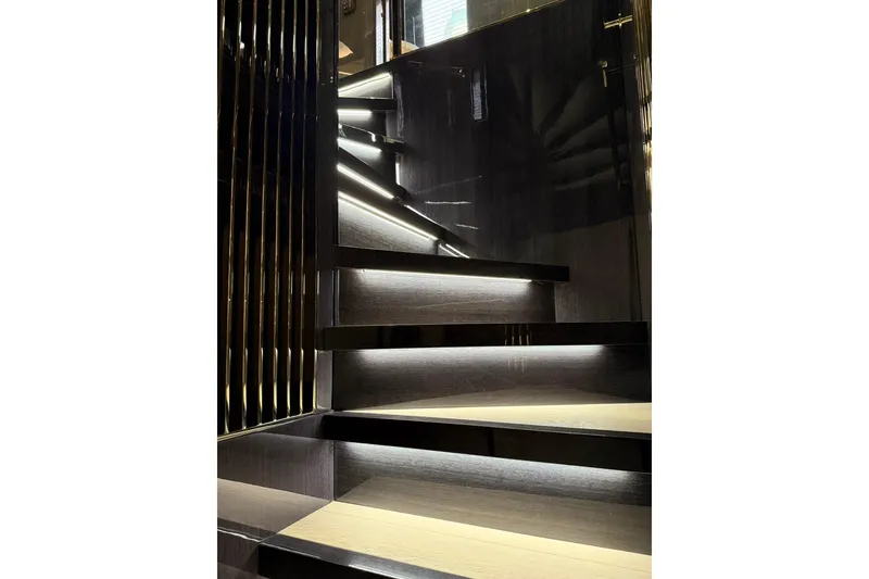 Slide: The Image of Luxurious staircase with ambient lighting on the 2024 Sirena 88 yacht. - 119