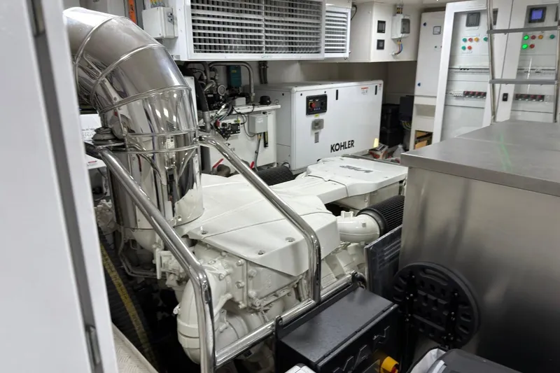 Slide: The Image of Engine room of 2024 Sirena 88 yacht, featuring advanced machinery and control panels. - 142