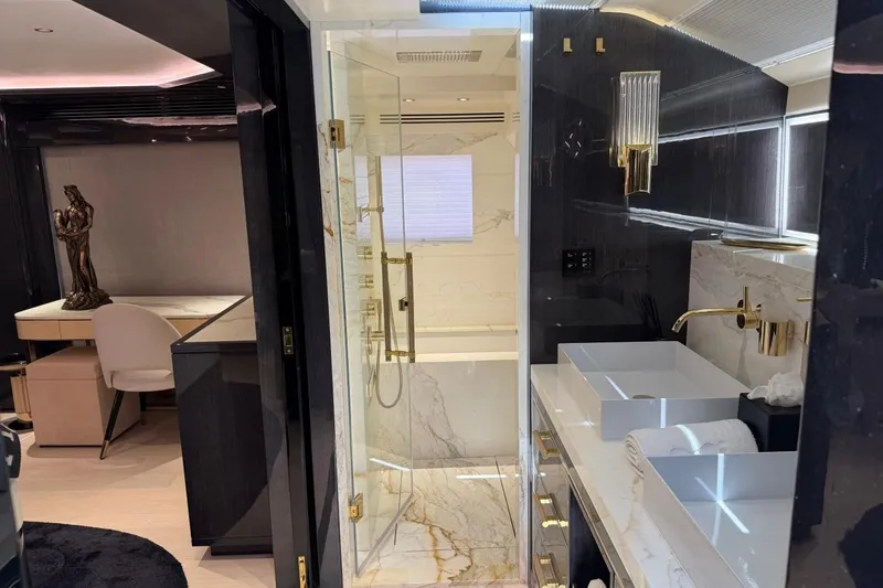 Slide: The Image of Luxurious bathroom interior of 2024 Sirena 88 yacht with marble and gold accents. - 125