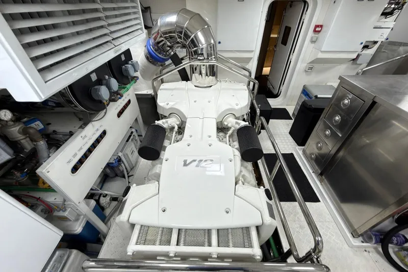 Slide: The Image of Engine room of 2024 Sirena 88 yacht, featuring a powerful V12 engine setup. - 143