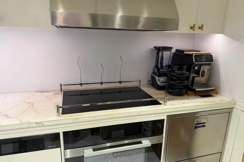 Slide: The Image of Modern kitchen with sleek appliances, marble countertop, and stainless steel accents, Sirena 88, 2024. - 151