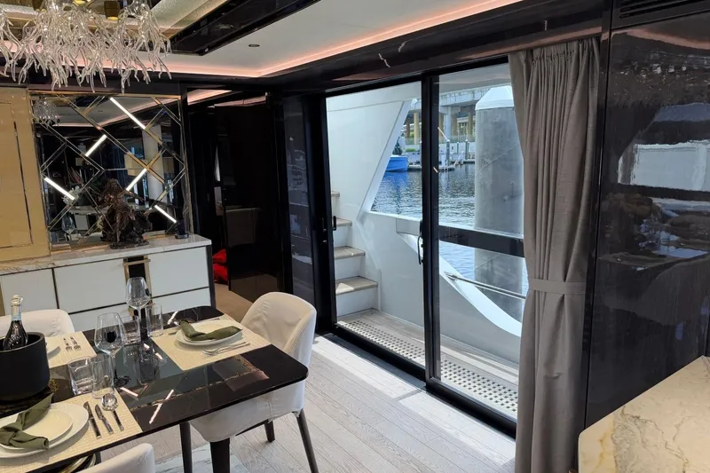 Slide: The Image of Luxurious interior of 2024 Sirena 88 yacht with elegant dining area and waterfront view. - 111