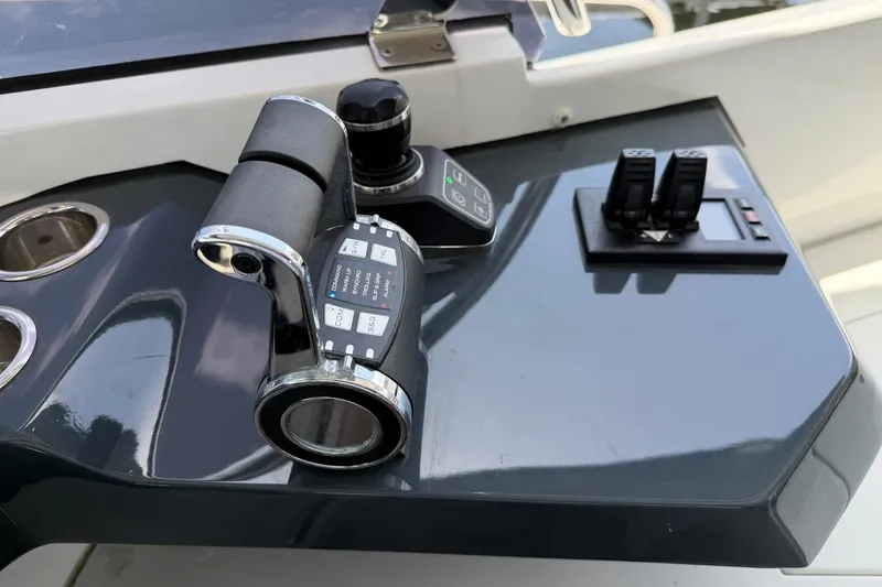Slide: The Image of Control panel of 2024 Sirena 88 yacht featuring throttle and joystick controls. - 10