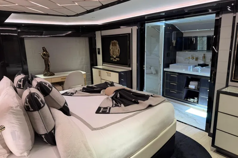 Slide: The Image of Luxurious 2024 Sirena 88 yacht bedroom with elegant decor and modern ensuite bathroom. - 123