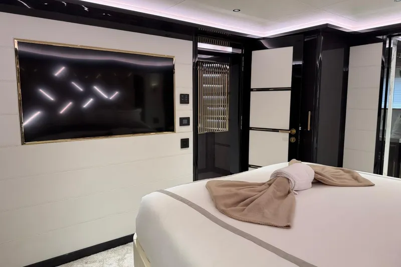 Slide: The Image of Luxurious interior of 2024 Sirena 88 yacht with modern decor and elegant bedding. - 69