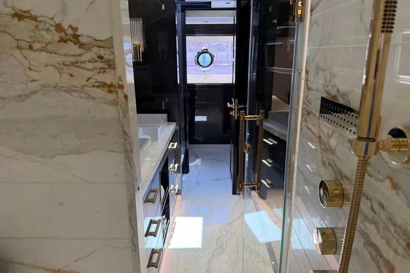 Slide: The Image of Luxurious bathroom interior of 2024 Sirena 88 yacht with marble and gold accents. - 126