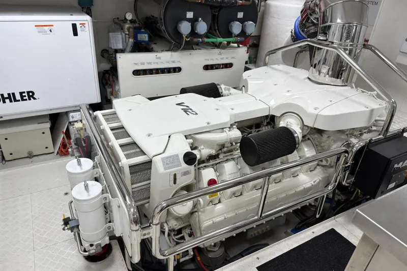 Slide: The Image of Engine room of 2024 Sirena 88 yacht featuring a powerful V12 engine. - 146