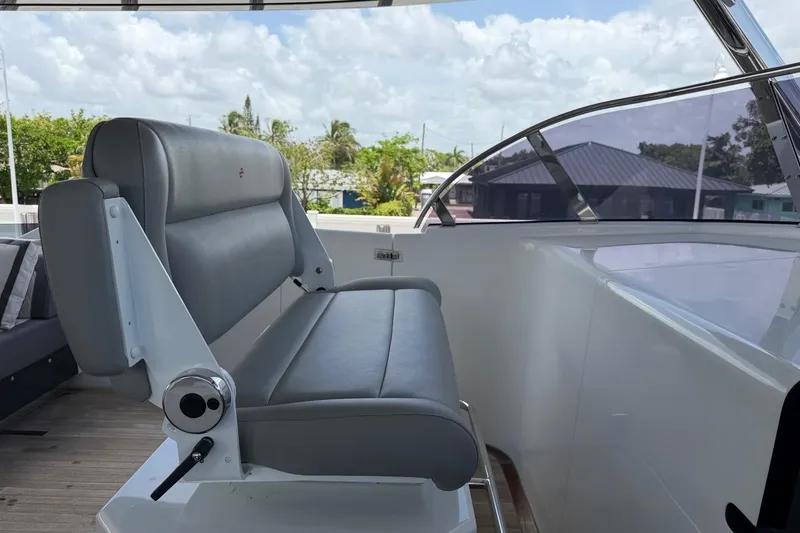 Slide: The Image of Captain's chair on 2024 Sirena 88 yacht, featuring sleek design and luxurious seating. - 54