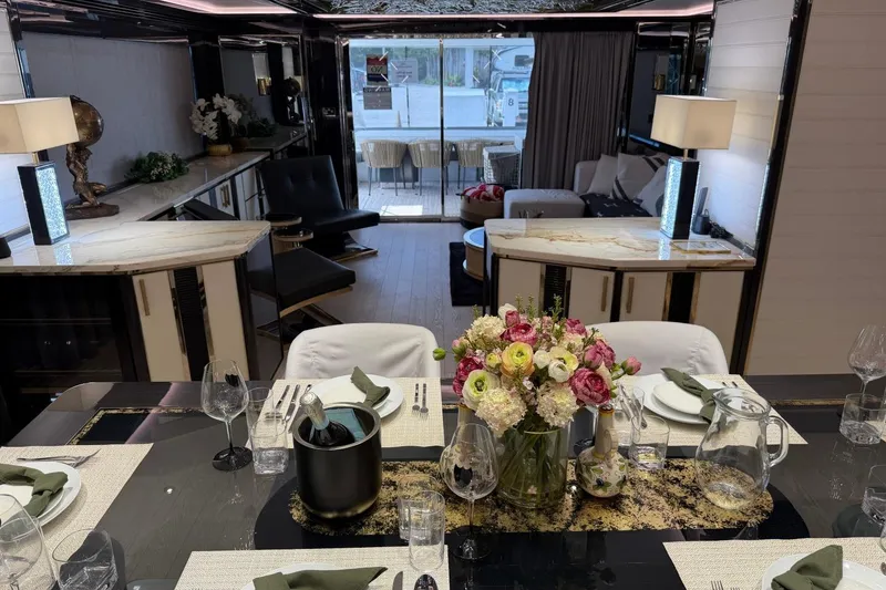 Slide: The Image of Luxurious interior of 2024 Sirena 88 yacht with elegant dining setup and modern decor. - 102