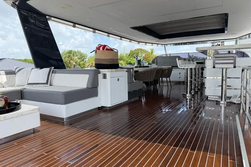 Slide: The Image of Luxurious 2024 Sirena 88 yacht deck with elegant seating and polished wood flooring. - 42