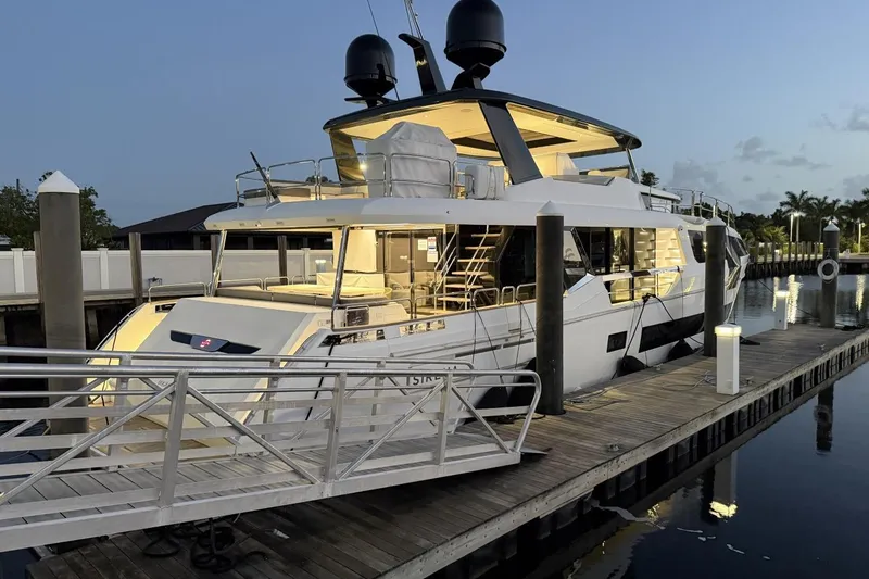 Slide: The Image of Luxury 2024 Sirena 88 yacht docked at marina during twilight. - 59