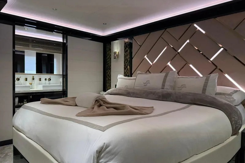 Slide: The Image of Luxurious bedroom interior of 2024 Sirena 88 yacht, featuring elegant bedding and modern design. - 117