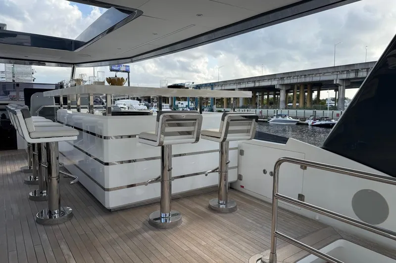 Slide: The Image of Luxurious 2024 Sirena 88 yacht deck with sleek bar and modern seating. - 27
