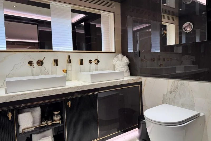 Slide: The Image of Luxurious bathroom interior on 2024 Sirena 88 yacht, featuring marble countertops and modern fixtures. - 73