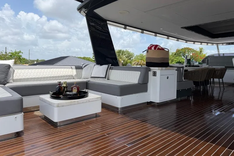 Slide: The Image of Luxurious 2024 Sirena 88 yacht deck with elegant seating and polished wood flooring. - 41