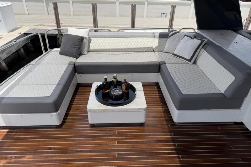 Slide: The Image of Luxurious seating area on 2024 Sirena 88 yacht with elegant cushions and drinks table. - 45