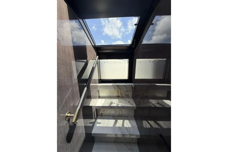 Slide: The Image of Staircase with marble steps and skylight on Sirena 88 yacht, 2024 model. - 129