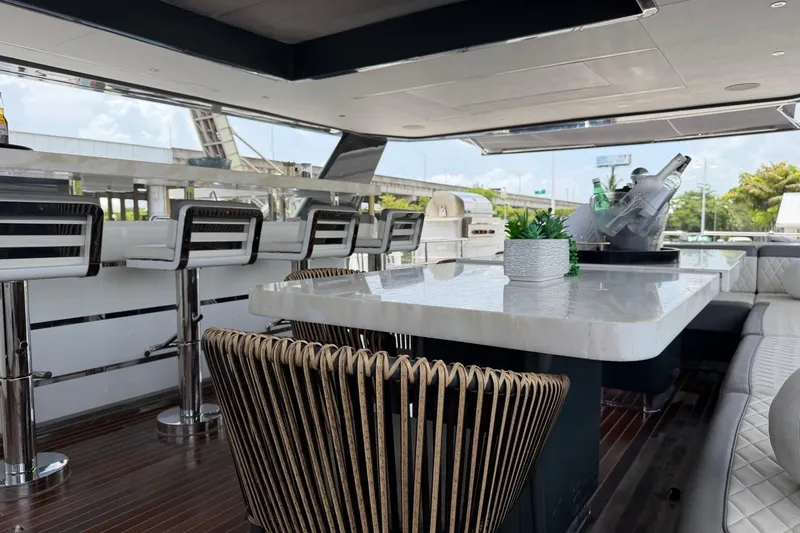 Slide: The Image of Luxurious 2024 Sirena 88 yacht interior with elegant seating and modern bar area. - 46