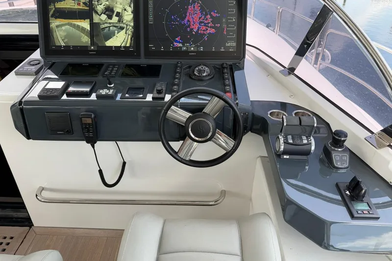 Slide: The Image of Cockpit of 2024 Sirena 88 yacht with advanced navigation controls and displays. - 7