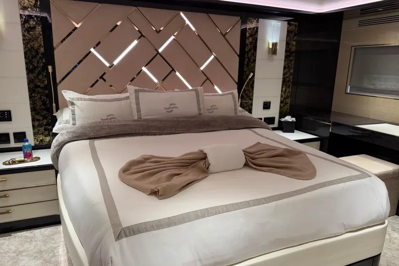 Slide: The Image of Luxurious bedroom interior of 2024 Sirena 88 yacht with elegant bedding and modern decor. - 116
