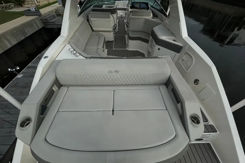 Slide: The Image of 2024 Sea Ray SLX 310 Outboard luxury boat interior with spacious seating and elegant design. - 10