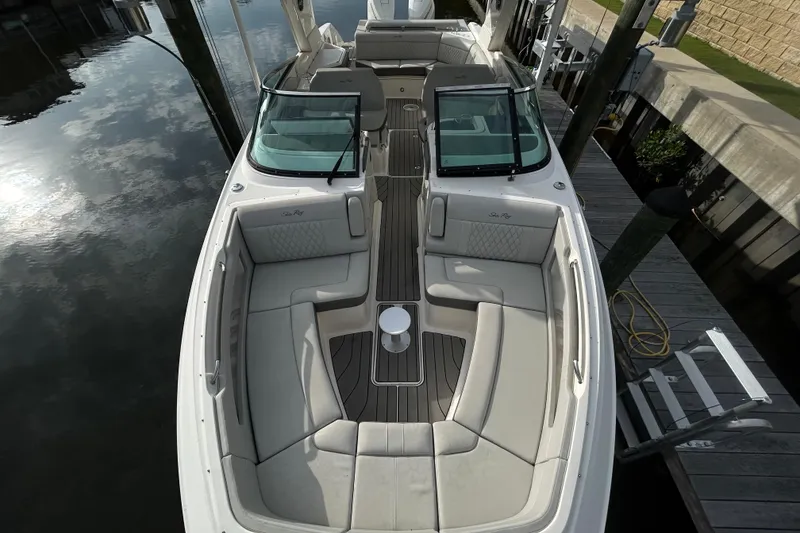Slide: The Image of 2024 Sea Ray SLX 310 Outboard boat with spacious seating and sleek design. - 100