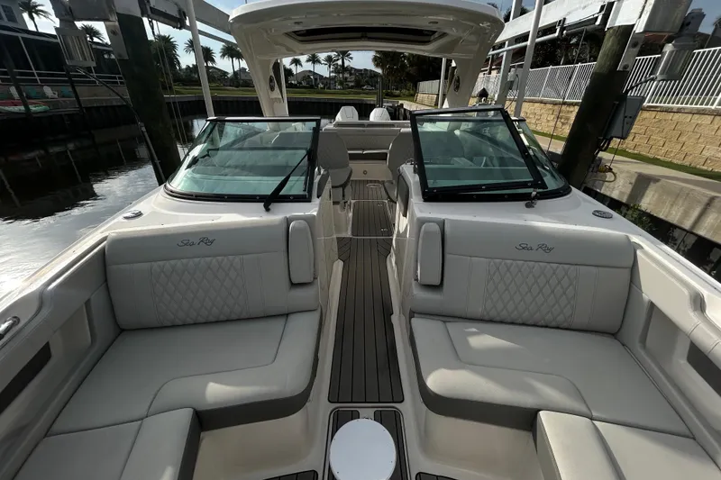 Slide: The Image of 2024 Sea Ray SLX 310 Outboard boat interior with luxurious seating and sleek design. - 103