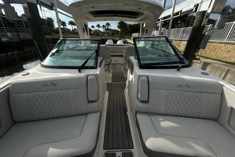 Slide: The Image of 2024 Sea Ray SLX 310 Outboard boat interior with luxurious seating and sleek design. - 104