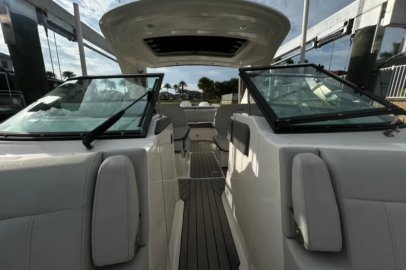 Slide: The Image of 2024 Sea Ray SLX 310 Outboard boat interior with sleek seating and modern design. - 105