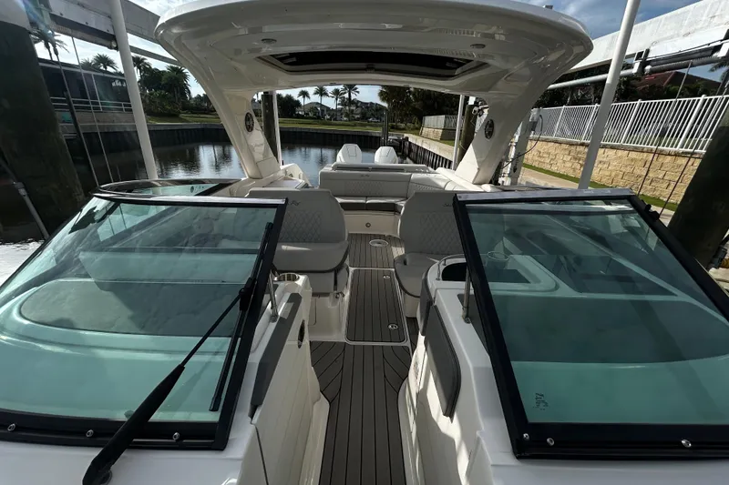 Slide: The Image of 2024 Sea Ray SLX 310 Outboard boat interior with sleek design and spacious seating. - 109