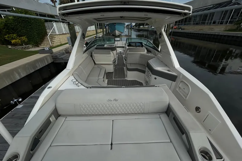 Slide: The Image of 2024 Sea Ray SLX 310 Outboard luxury boat interior with spacious seating and modern design. - 11