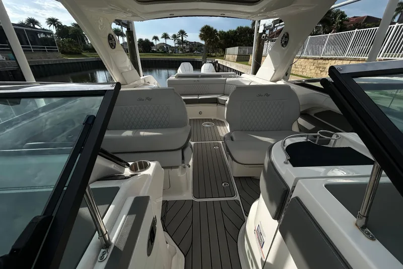 Slide: The Image of 2024 Sea Ray SLX 310 Outboard interior with luxurious seating and sleek design. - 110