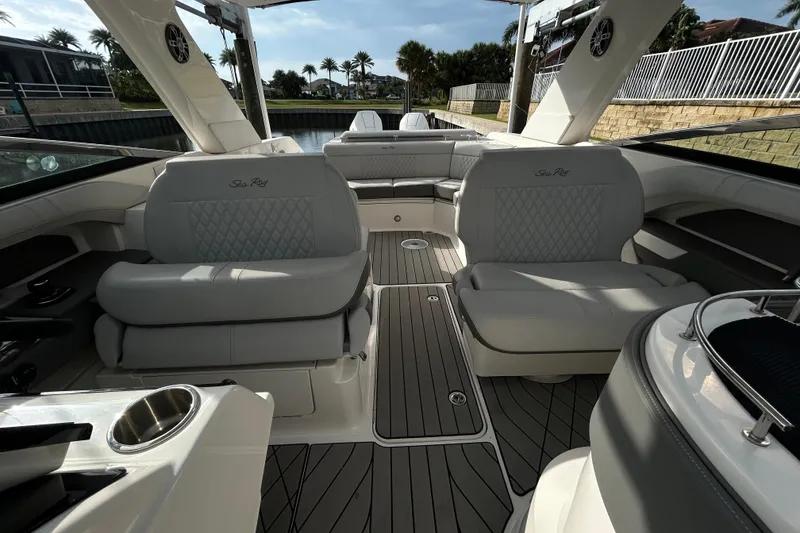 Slide: The Image of 2024 Sea Ray SLX 310 Outboard interior with luxurious seating and sleek design. - 111