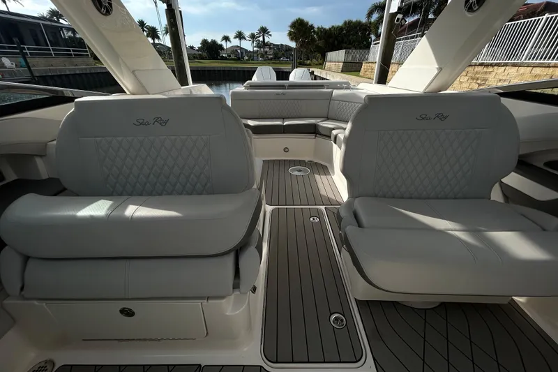 Slide: The Image of 2024 Sea Ray SLX 310 Outboard interior with luxurious seating and elegant design. - 112