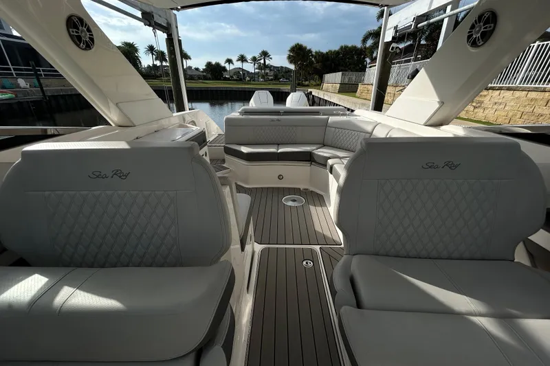 Slide: The Image of 2024 Sea Ray SLX 310 Outboard interior with luxurious seating and elegant design. - 115