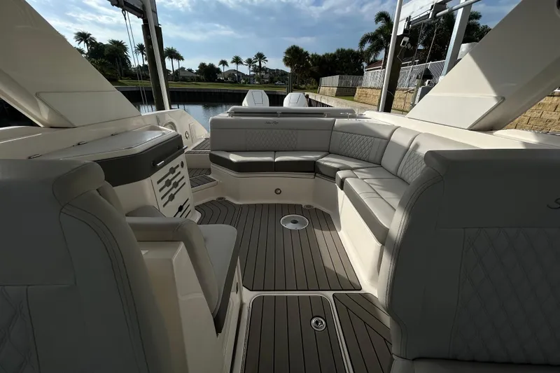 Slide: The Image of 2024 Sea Ray SLX 310 Outboard interior with luxurious seating and elegant design. - 117