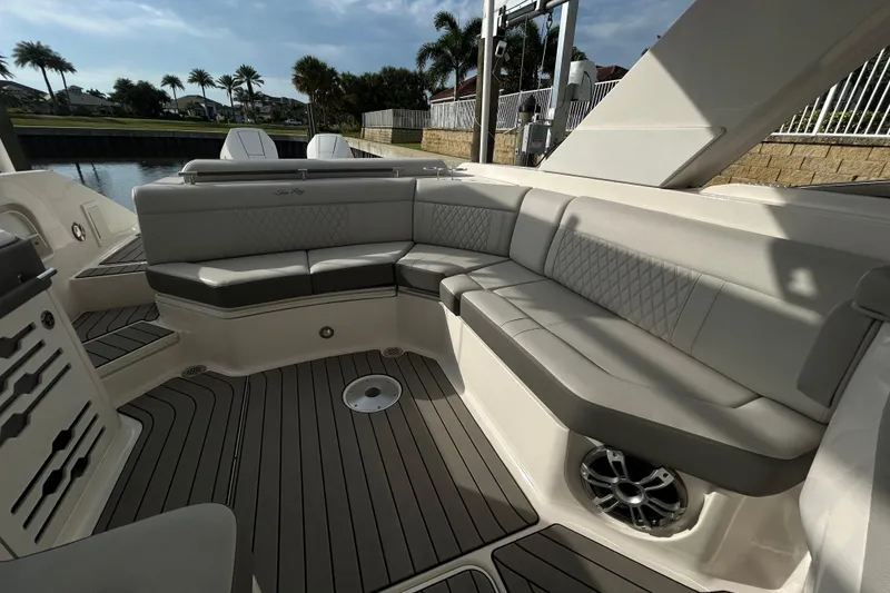 Slide: The Image of Luxurious seating area on 2024 Sea Ray SLX 310 Outboard boat, featuring elegant upholstery and sleek design. - 118