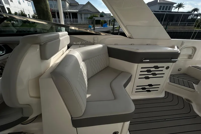 Slide: The Image of 2024 Sea Ray SLX 310 Outboard interior with luxurious seating and sleek design. - 120