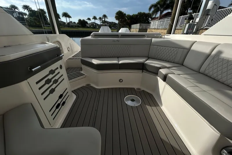 Slide: The Image of 2024 Sea Ray SLX 310 Outboard boat interior with luxurious seating and sleek design. - 121