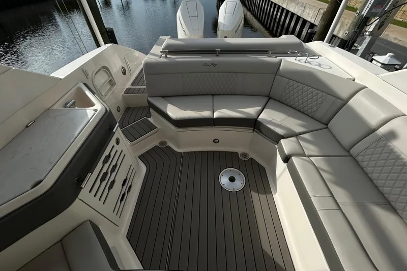 Slide: The Image of Luxurious seating area on the 2024 Sea Ray SLX 310 Outboard boat. - 122