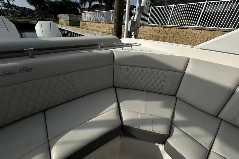Slide: The Image of 2024 Sea Ray SLX 310 Outboard boat interior with luxurious seating and elegant design. - 124