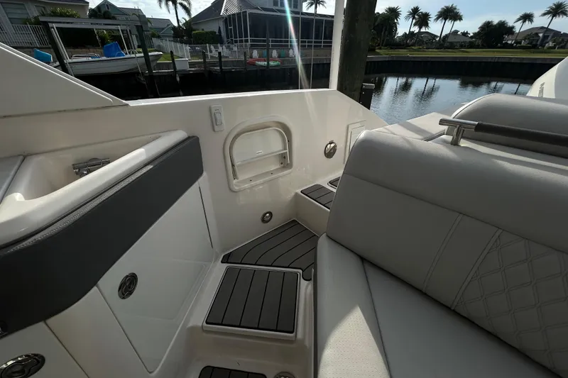 Slide: The Image of 2024 Sea Ray SLX 310 Outboard interior with luxurious seating and sleek design. - 126