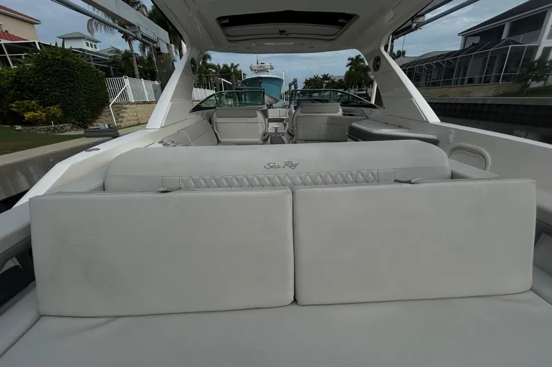 Slide: The Image of 2024 Sea Ray SLX 310 Outboard boat interior with luxurious seating and modern design. - 13