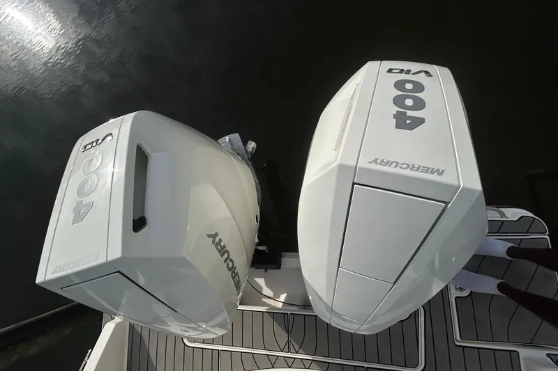 Slide: The Image of 2024 Sea Ray SLX 310 Outboard with twin Mercury 400 engines on water. - 136