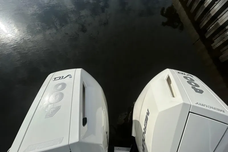 Slide: The Image of Twin Mercury 400 outboard engines on a 2024 Sea Ray SLX 310 boat. - 137