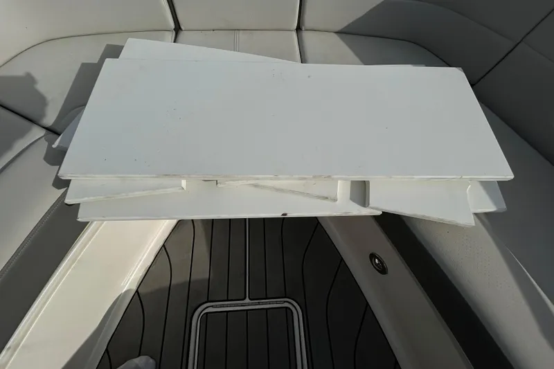 Slide: The Image of 2024 Sea Ray SLX 310 Outboard boat interior with white seating and flooring. - 139