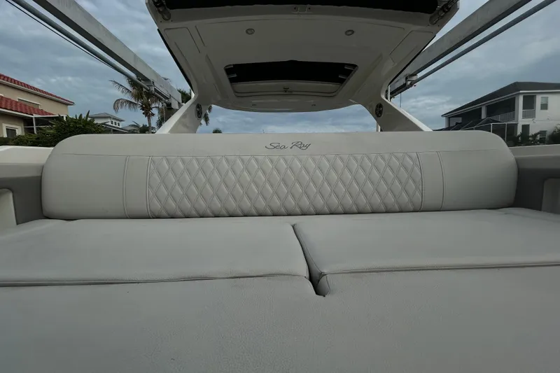 Slide: The Image of 2024 Sea Ray SLX 310 Outboard boat interior with luxurious seating and elegant design. - 14